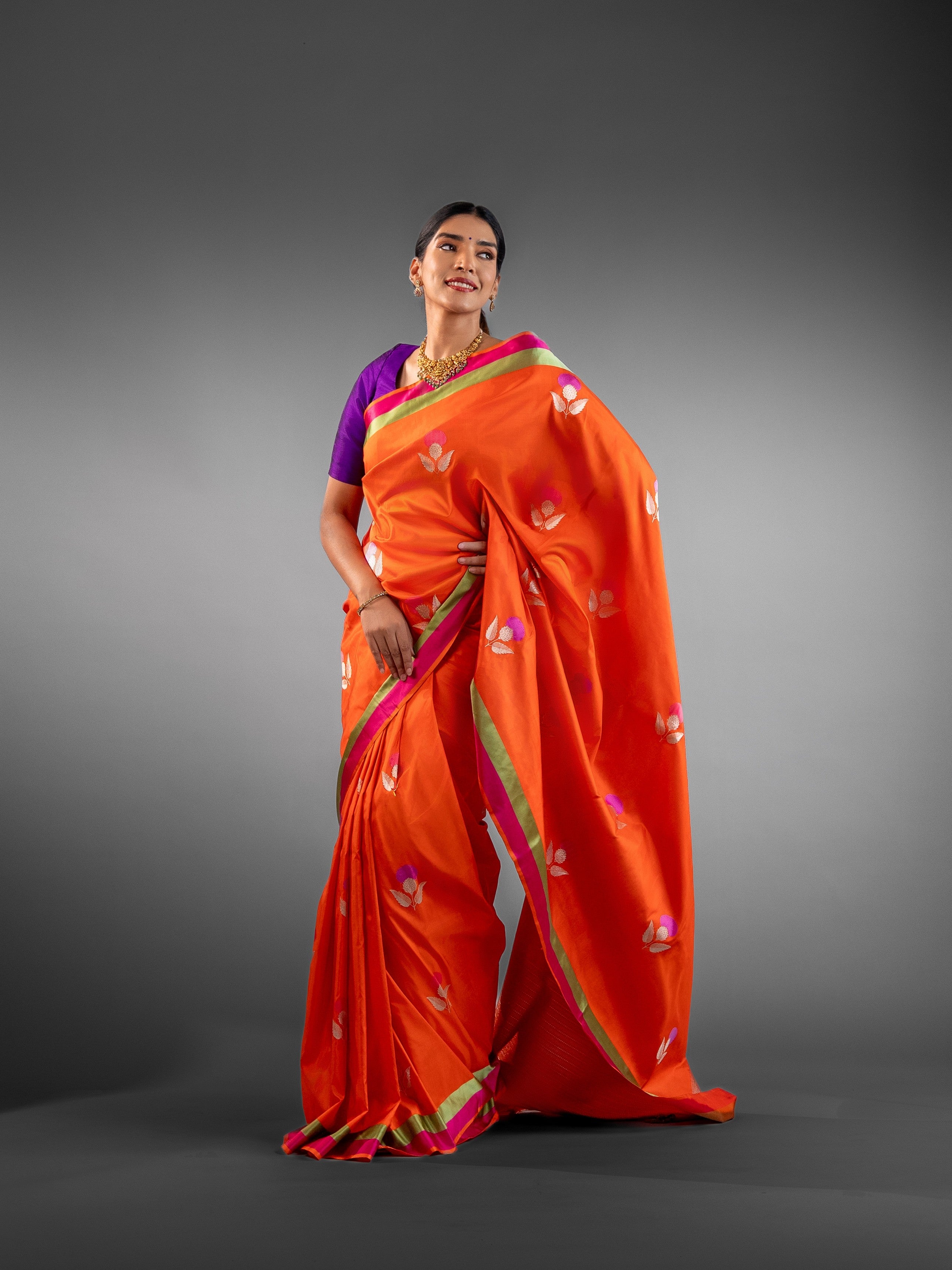 Radiant Orange Banarasi Silk Saree with Woven Floral Motifs