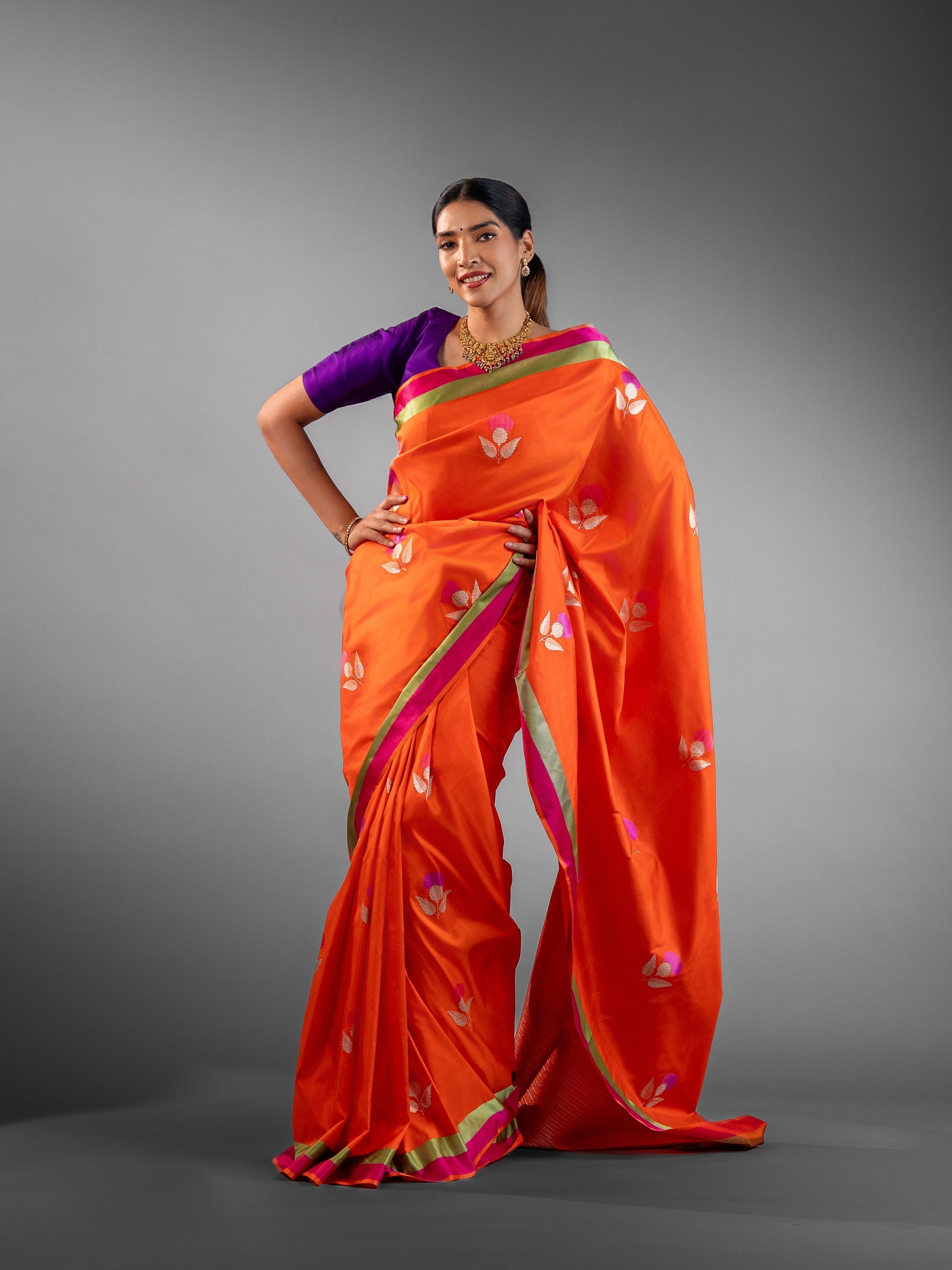 Radiant Orange Banarasi Silk Saree with Woven Floral Motifs