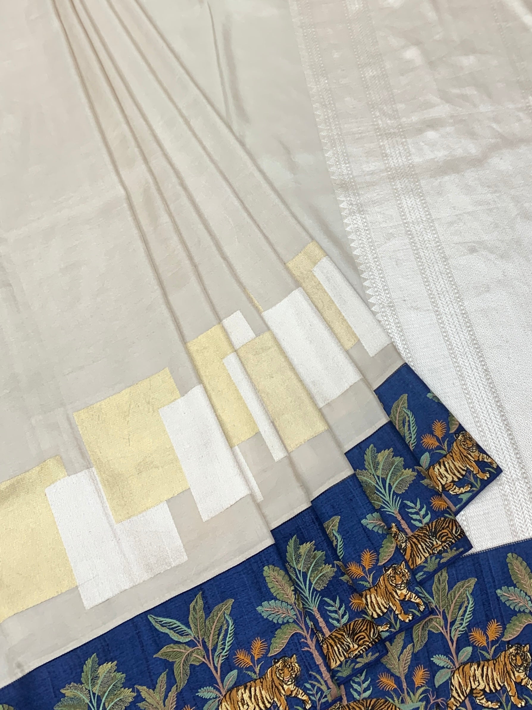 Majestic Wilderness: Fusion Tissue Banarasi Saree with Embroidered Border