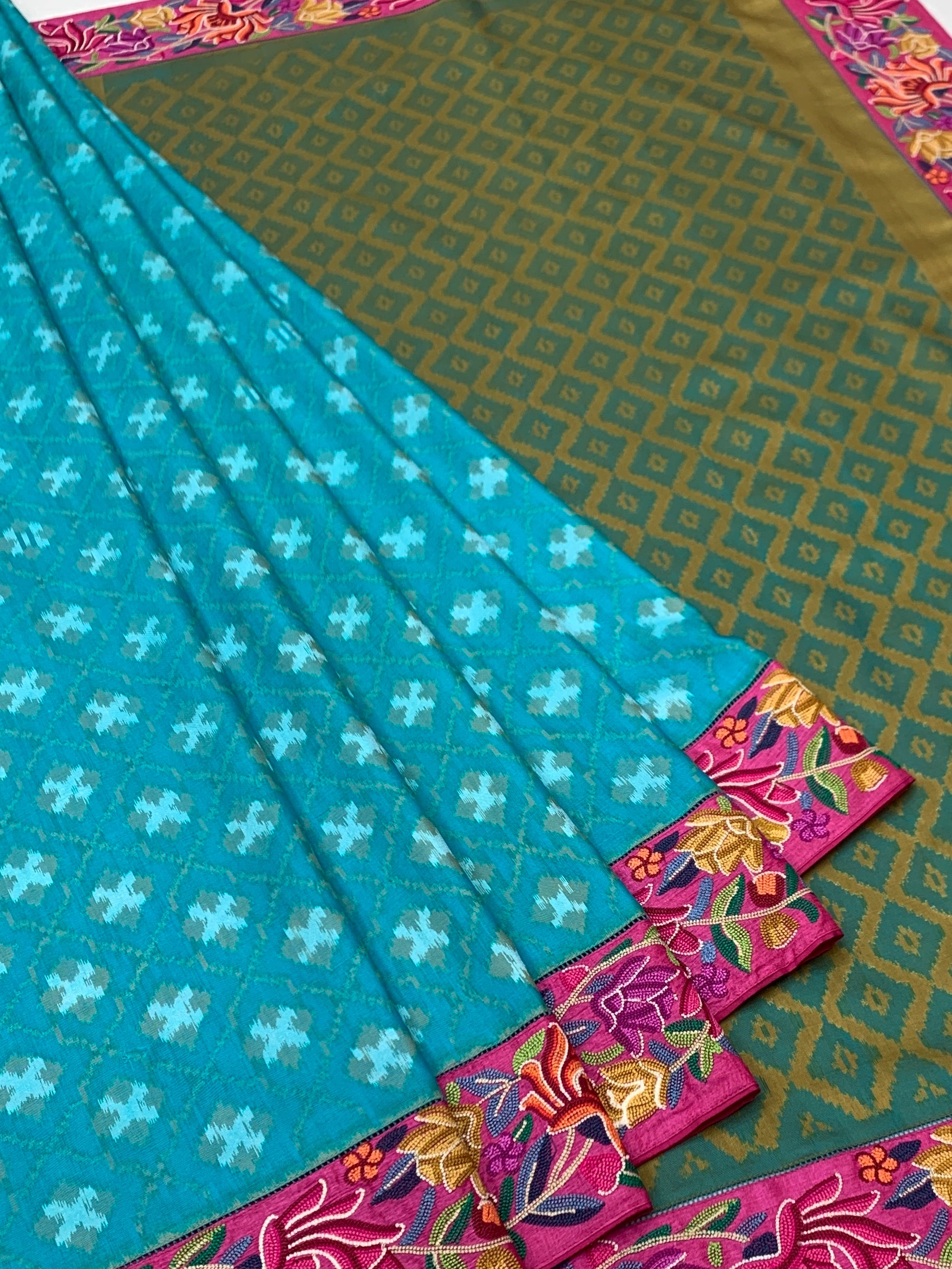Turquoise Blue Fusion Patola Saree with Petite Point Embroidery