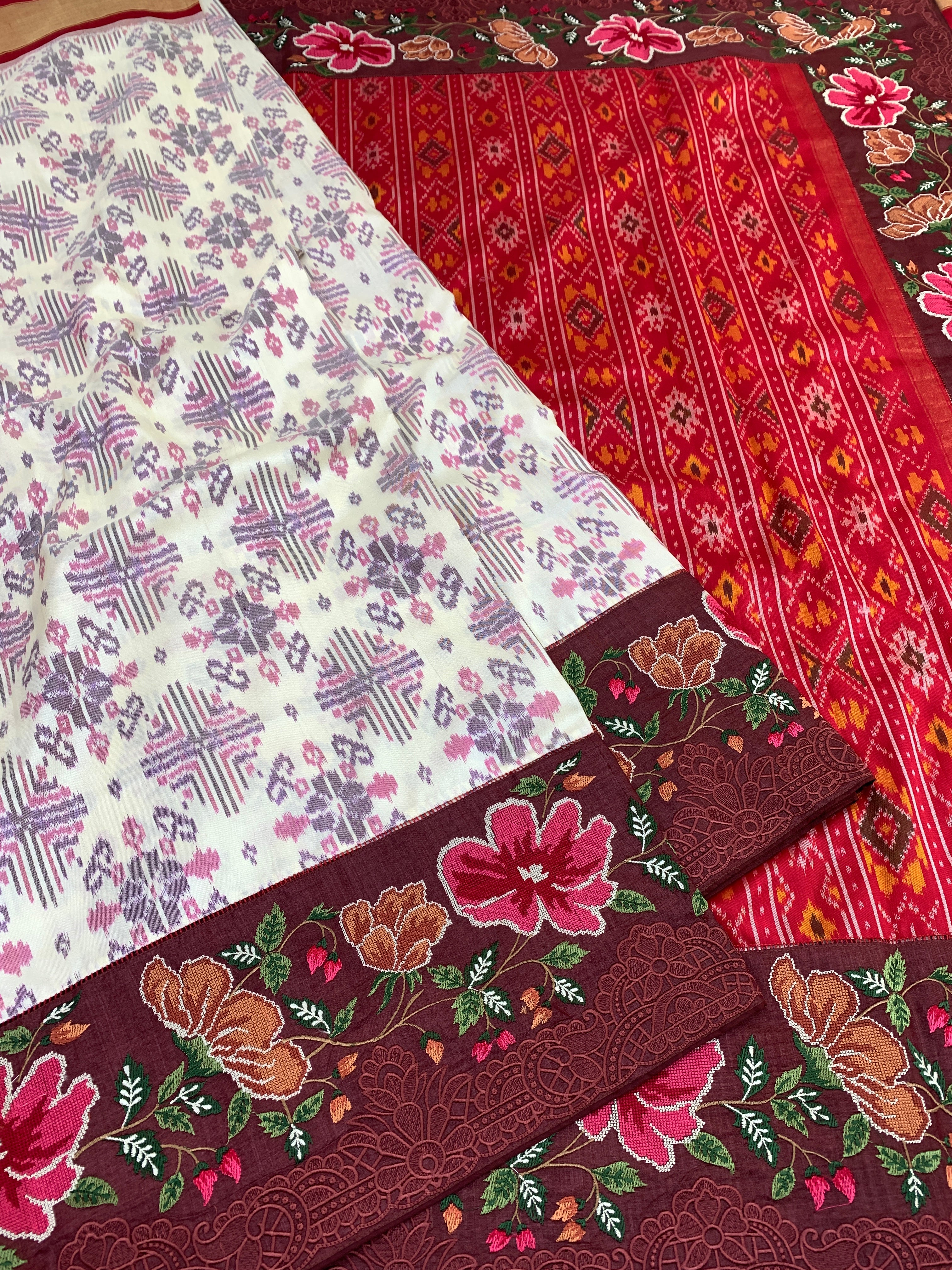 The Heritage Fusion: Cream & Ruby Patola Saree with Floral Embroidered Borders