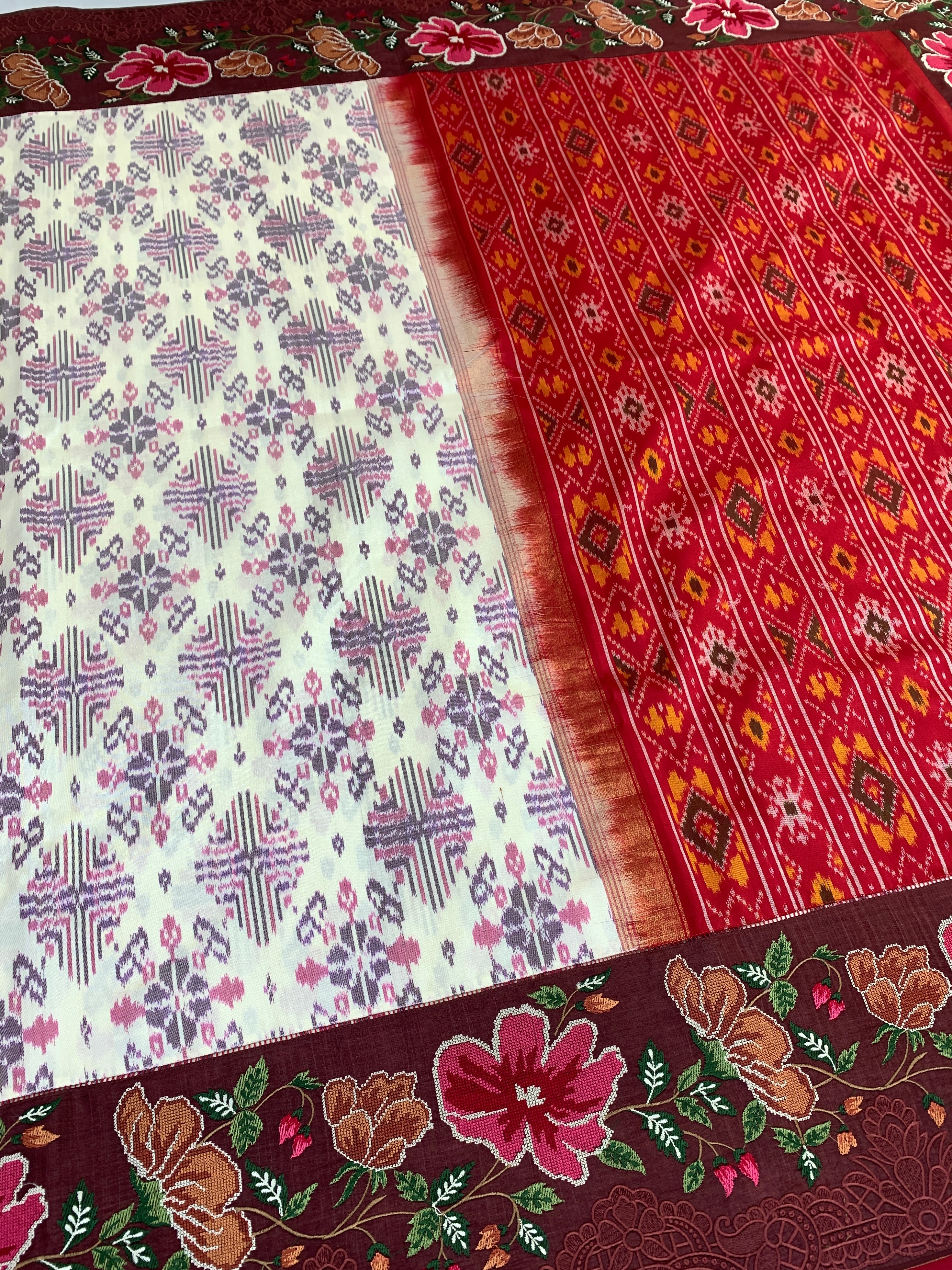 The Heritage Fusion: Cream & Ruby Patola Saree with Floral Embroidered Borders