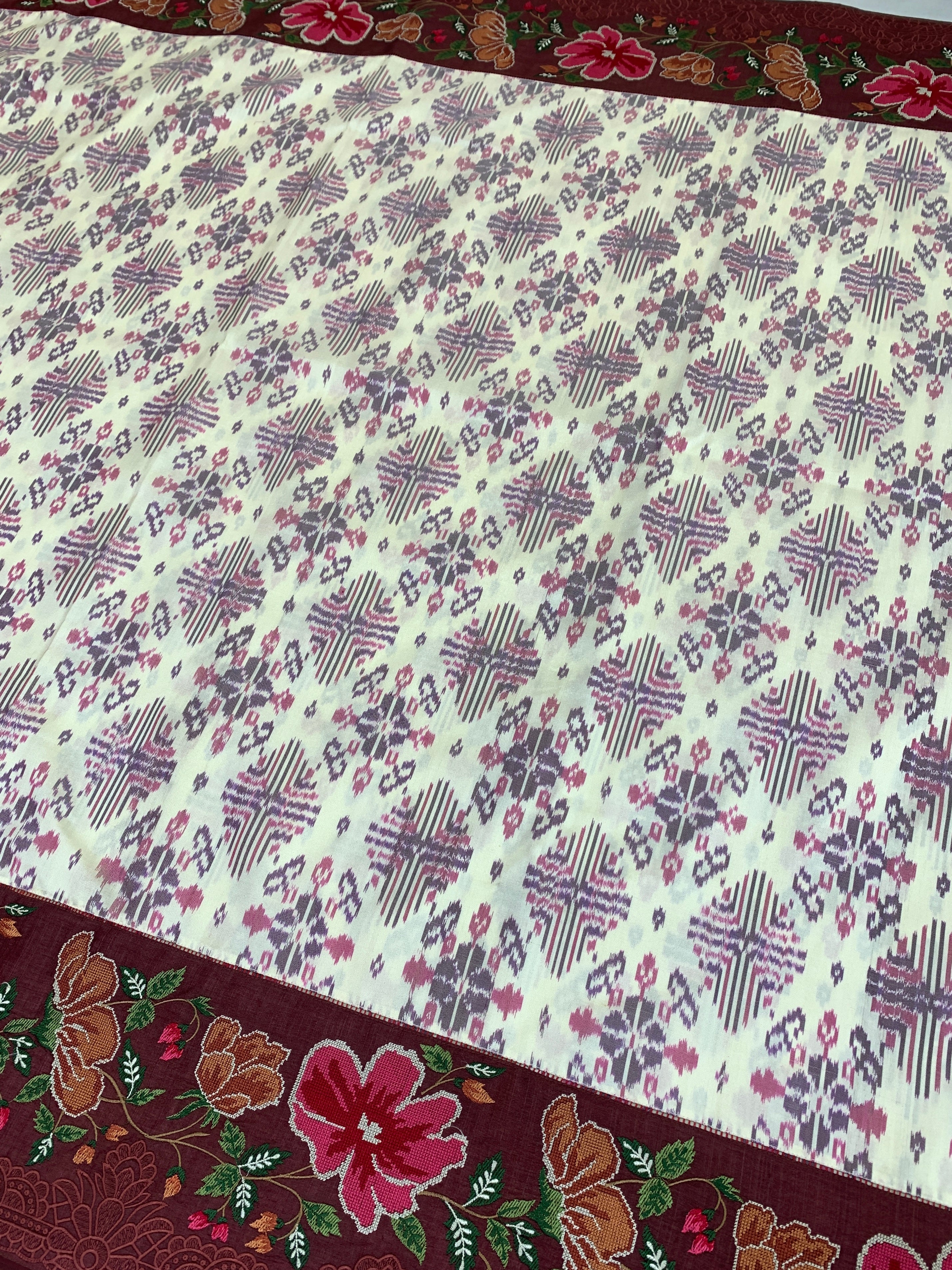 The Heritage Fusion: Cream & Ruby Patola Saree with Floral Embroidered Borders