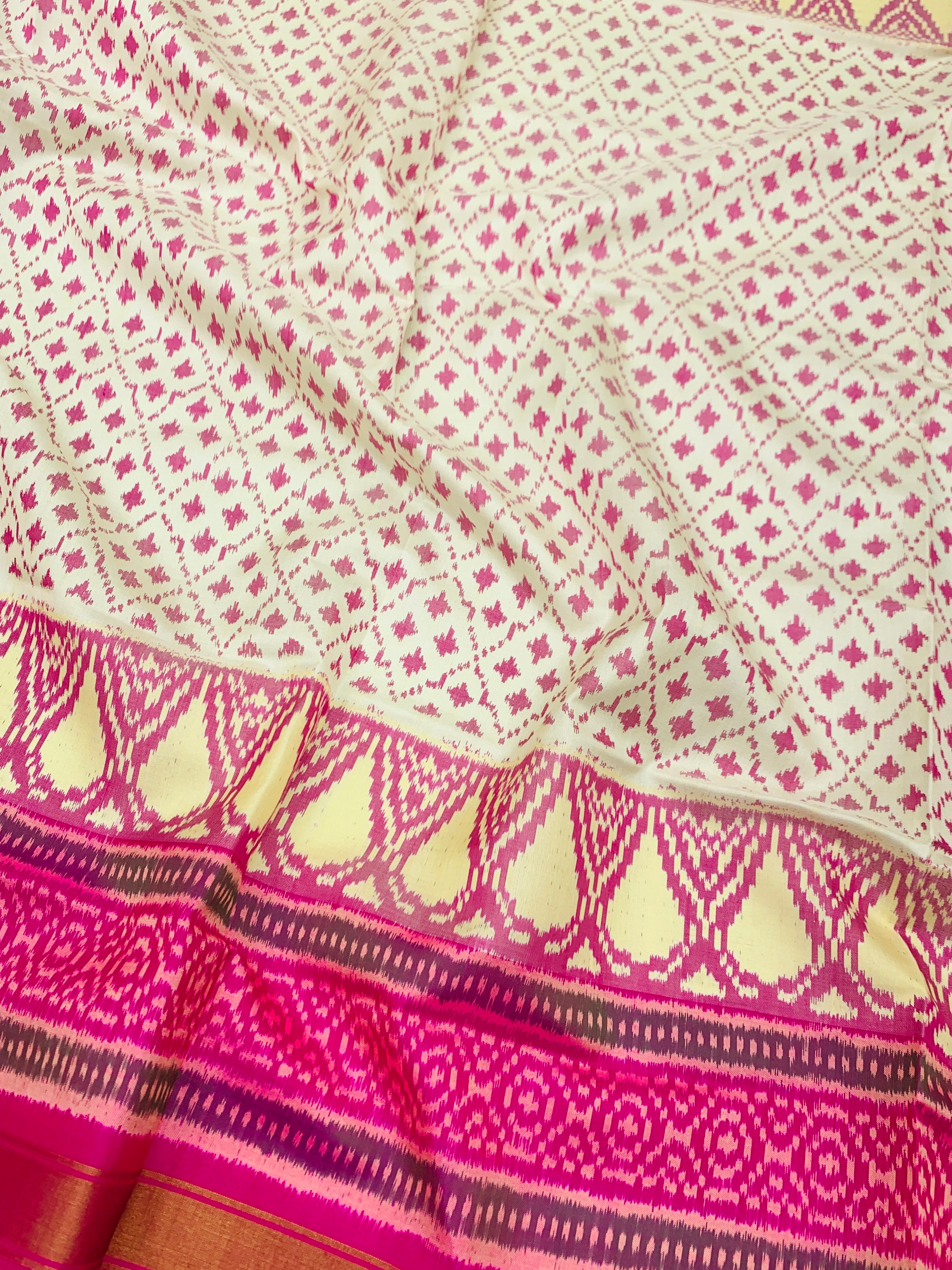 Exquisite Cream & Rani Pink Rajkot Patola Silk Saree