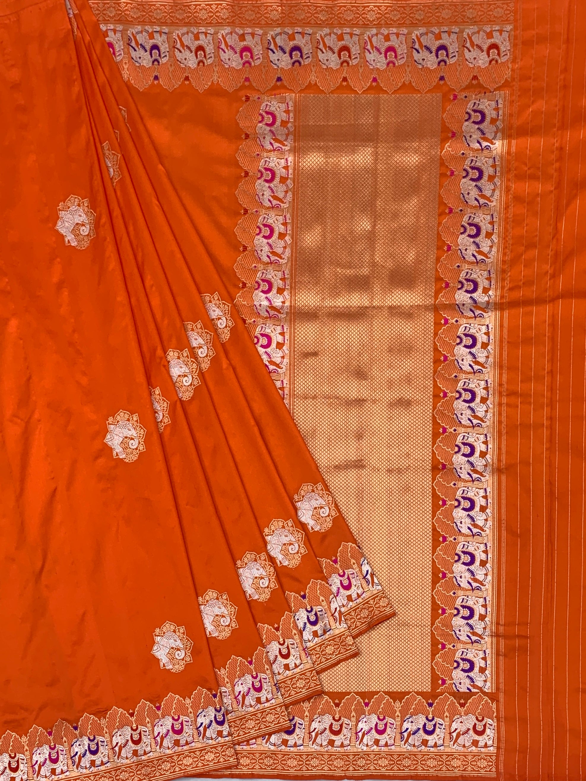 Exotic Tangerine Orange Banarasi Silk Saree with Elephant Motif Border