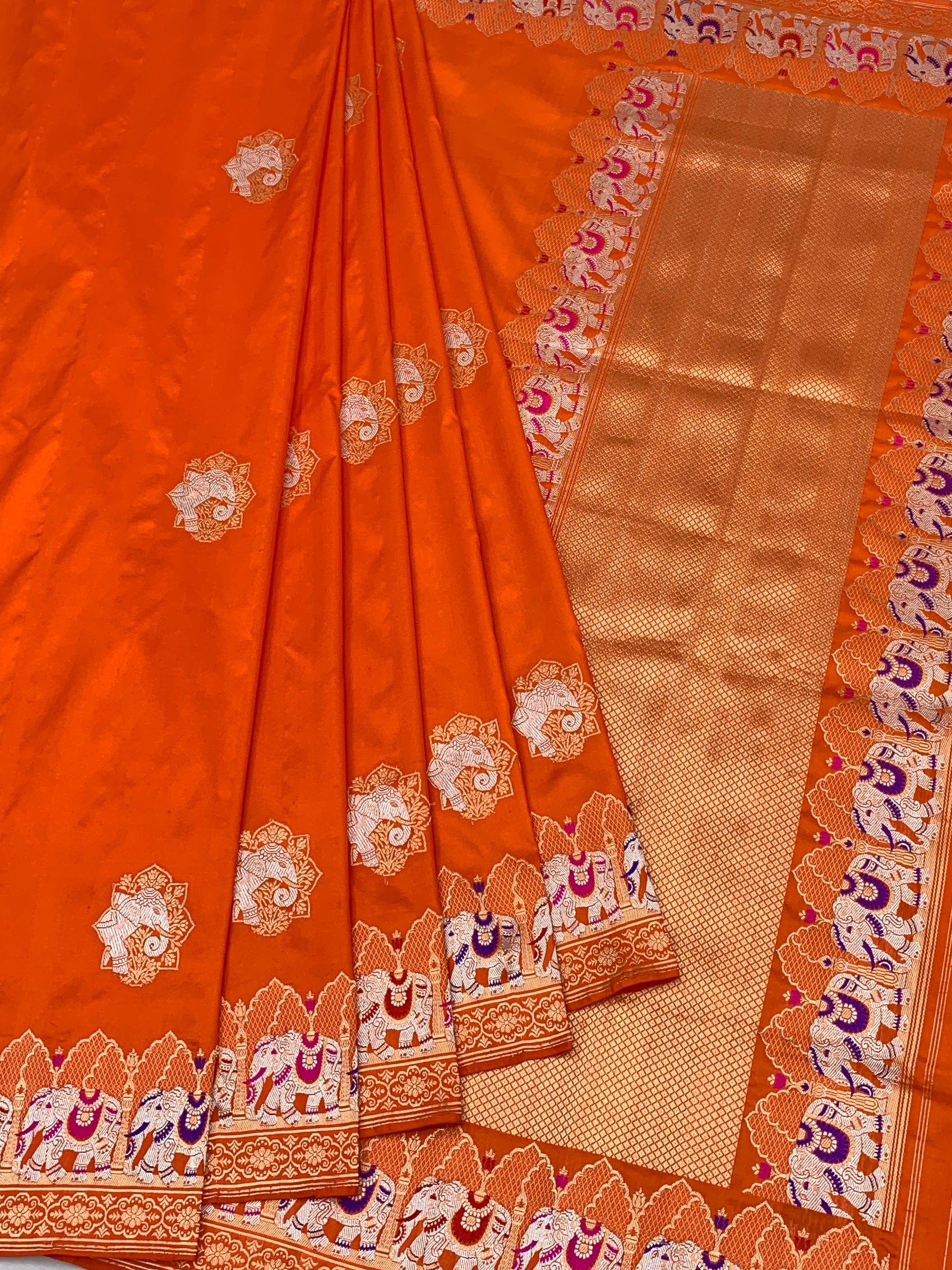Exotic Tangerine Orange Banarasi Silk Saree with Elephant Motif Border