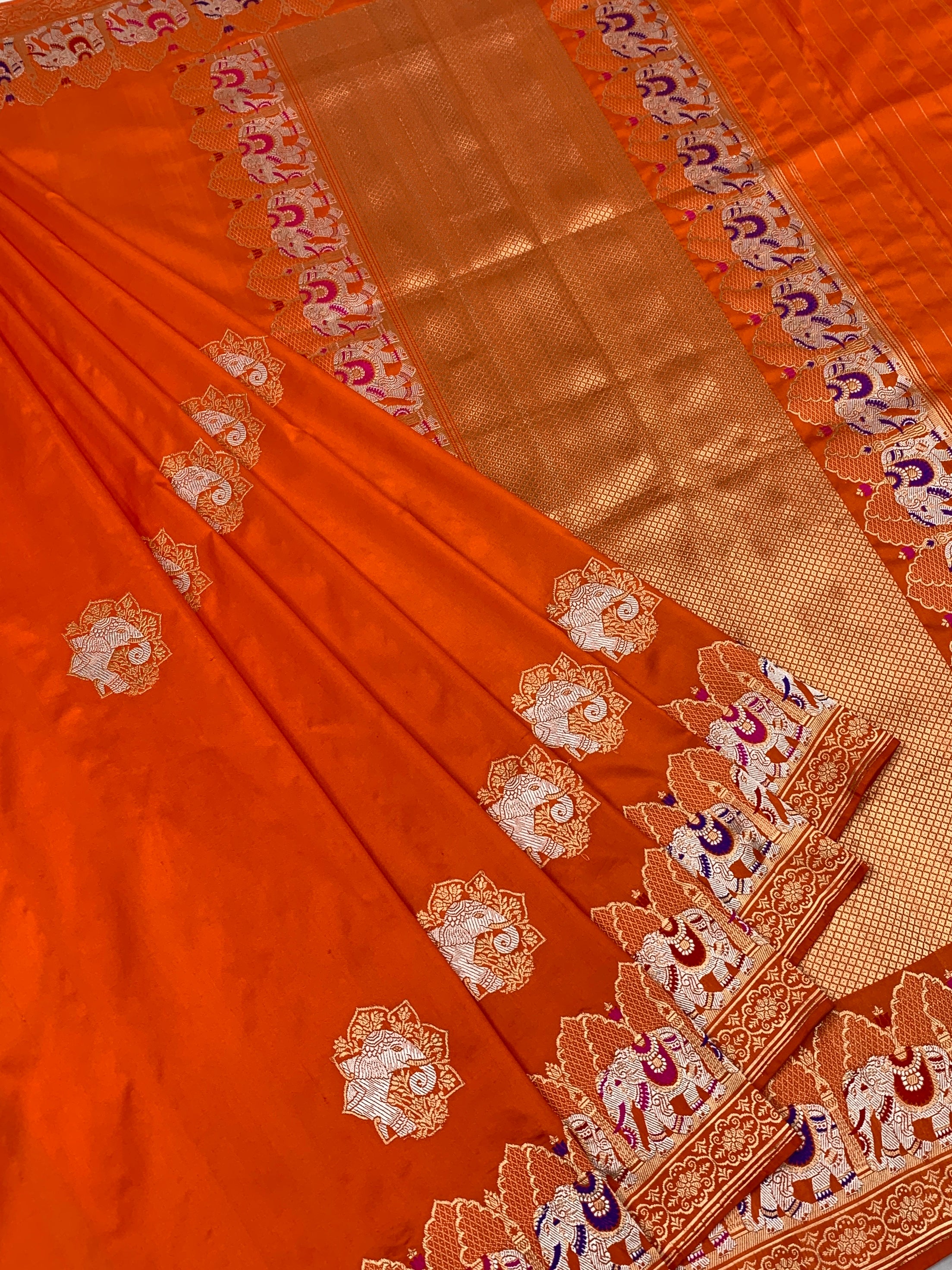 Exotic Tangerine Orange Banarasi Silk Saree with Elephant Motif Border
