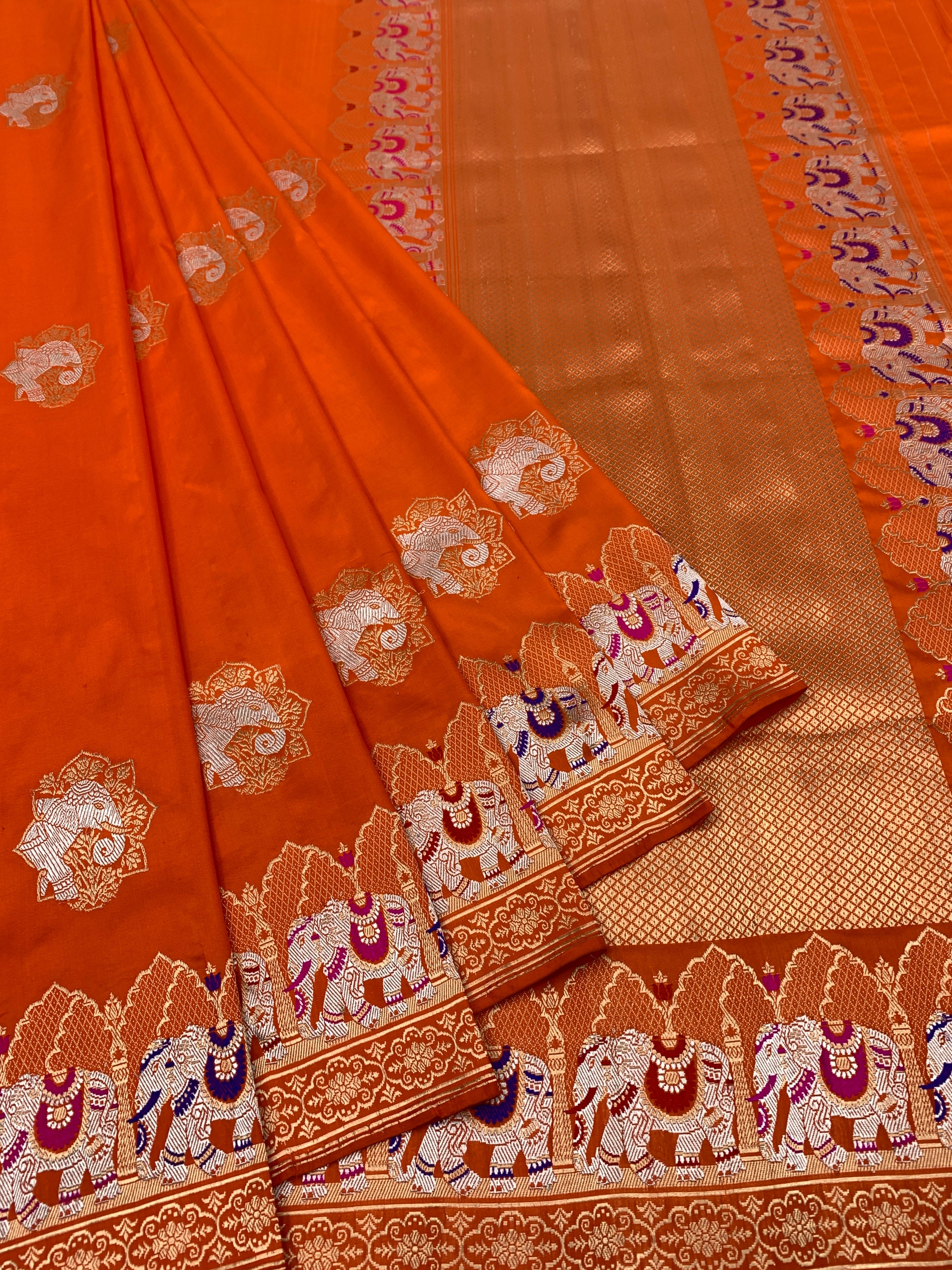Exotic Tangerine Orange Banarasi Silk Saree with Elephant Motif Border