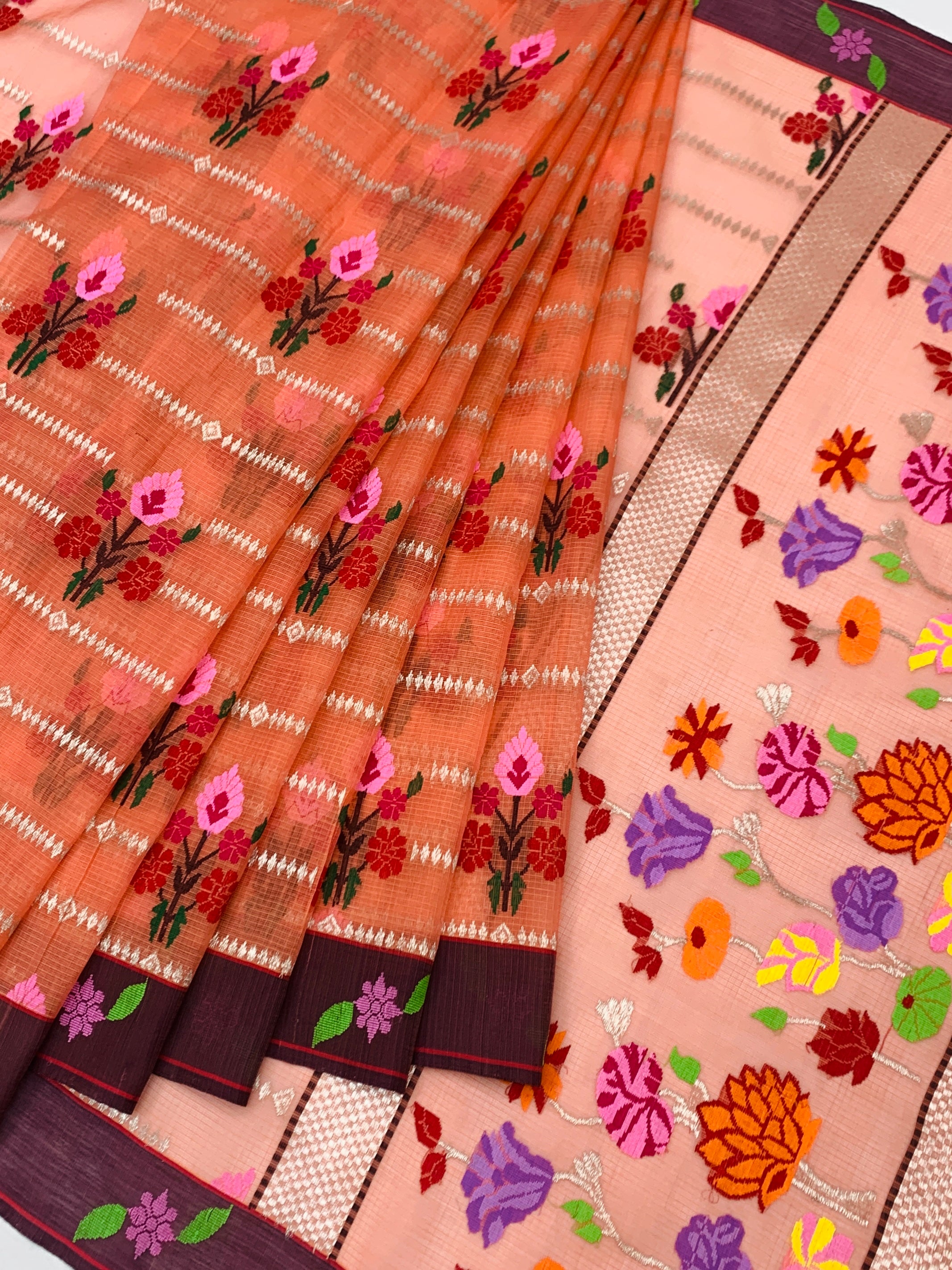 Radiant Peach Zari Kota Saree with Vibrant Floral Weaves