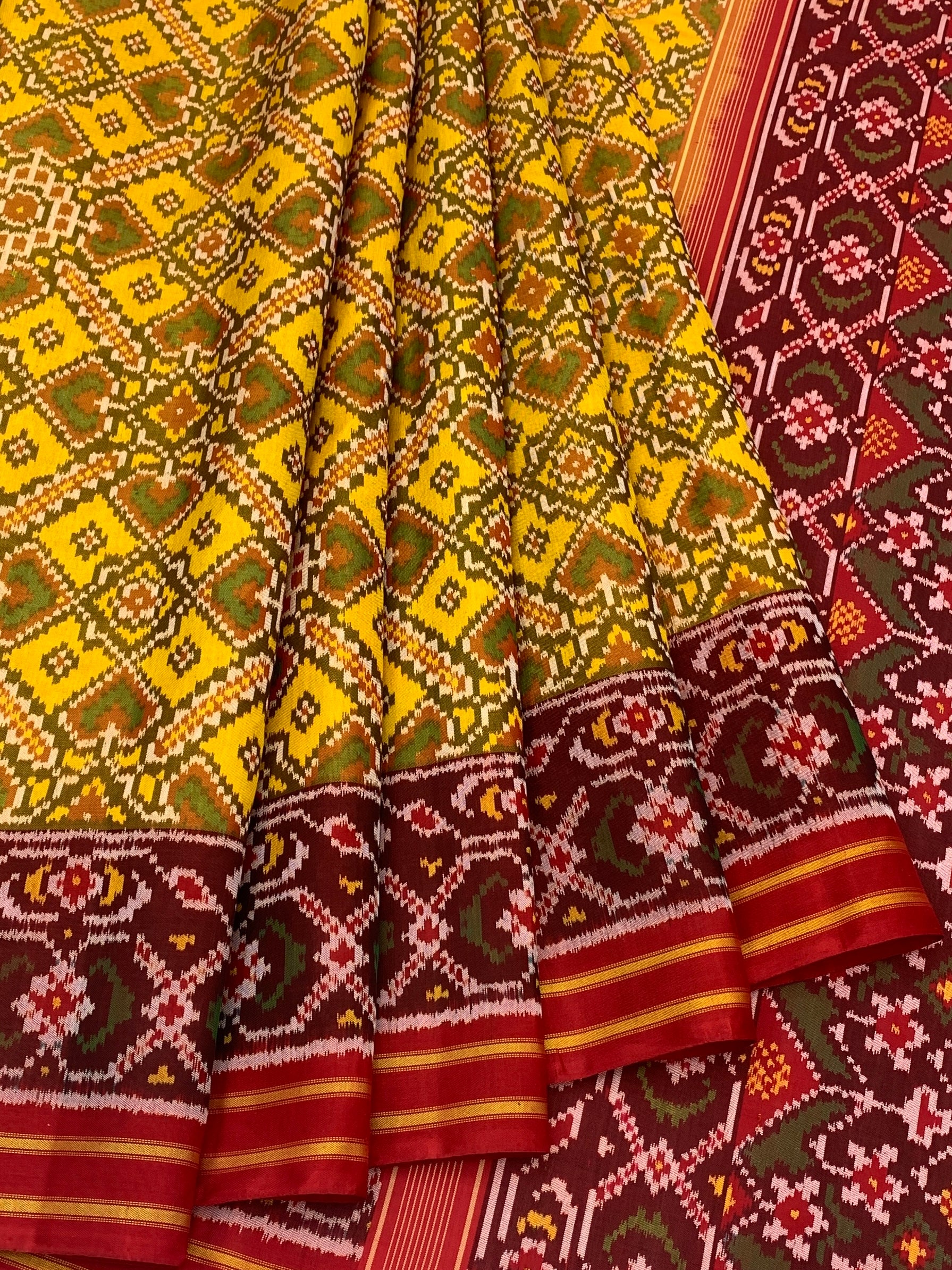 Radiant Heritage: Mustard Yellow and Maroon Traditional Patola Silk Saree