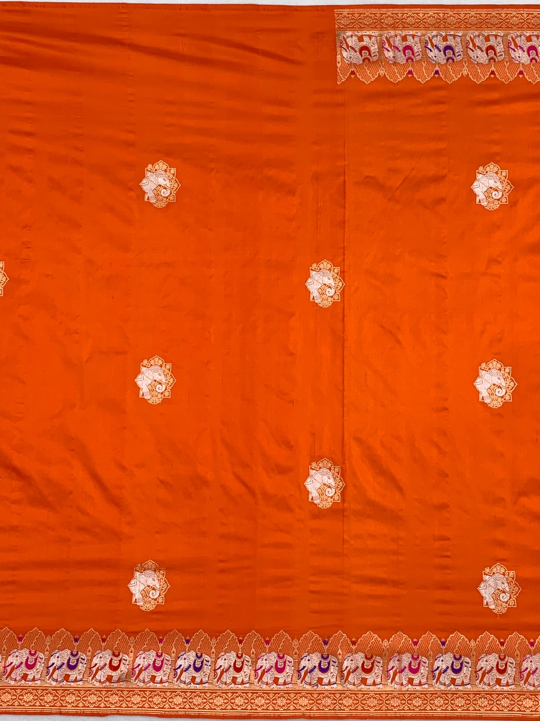 Exotic Tangerine Orange Banarasi Silk Saree with Elephant Motif Border