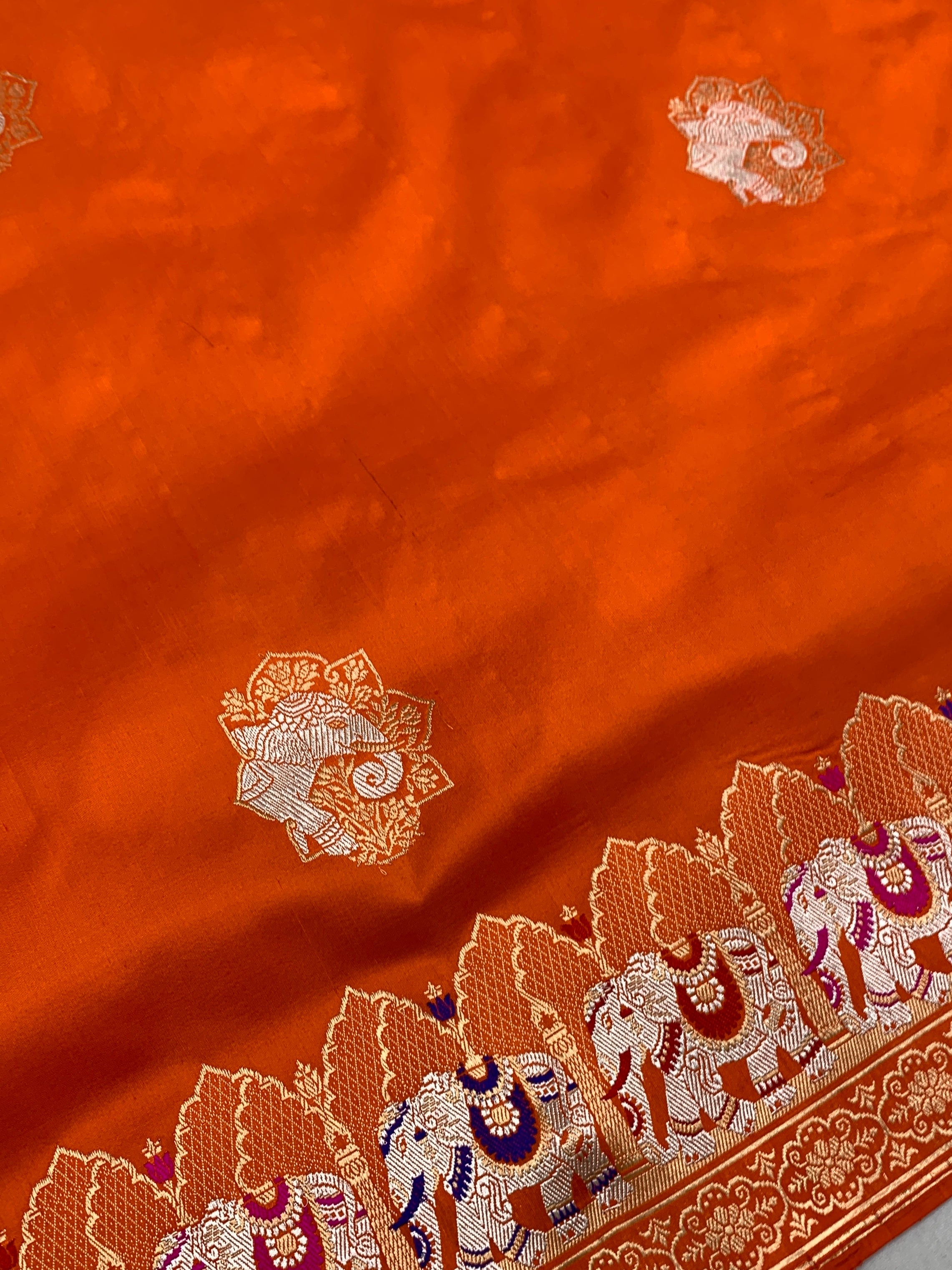 Exotic Tangerine Orange Banarasi Silk Saree with Elephant Motif Border