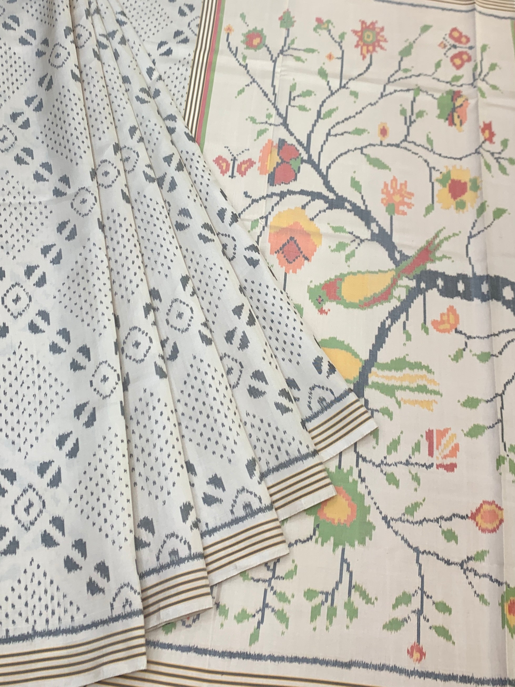 Pristine Ivory Patola Saree with Scenic 'Tree of Life' Pallu