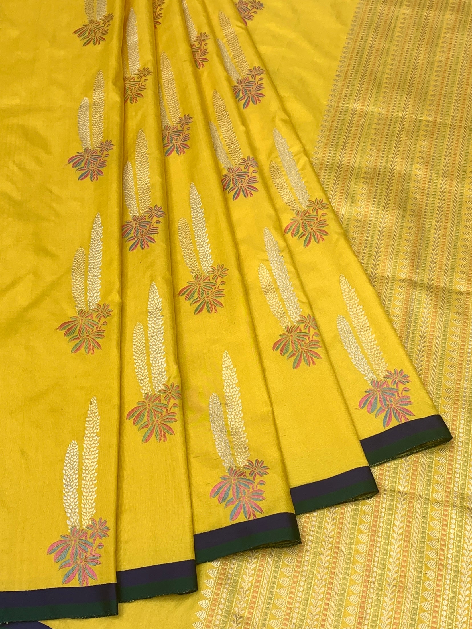 Radiant Yellow Banarasi Silk Saree with Woven Floral Motifs