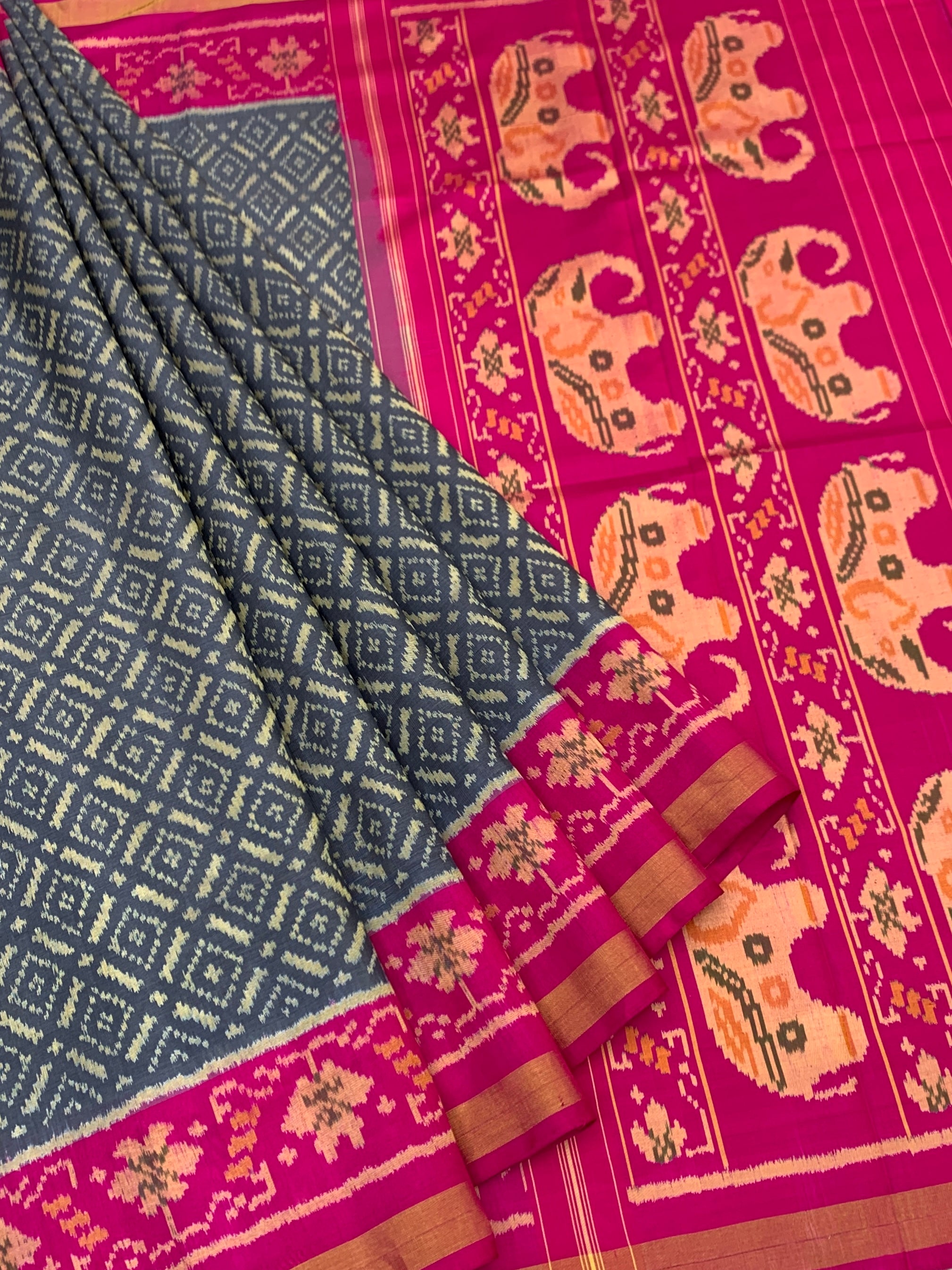 Regal Harmony: Charcoal & Magenta Elephant Motif Rajkot Patola Silk Saree