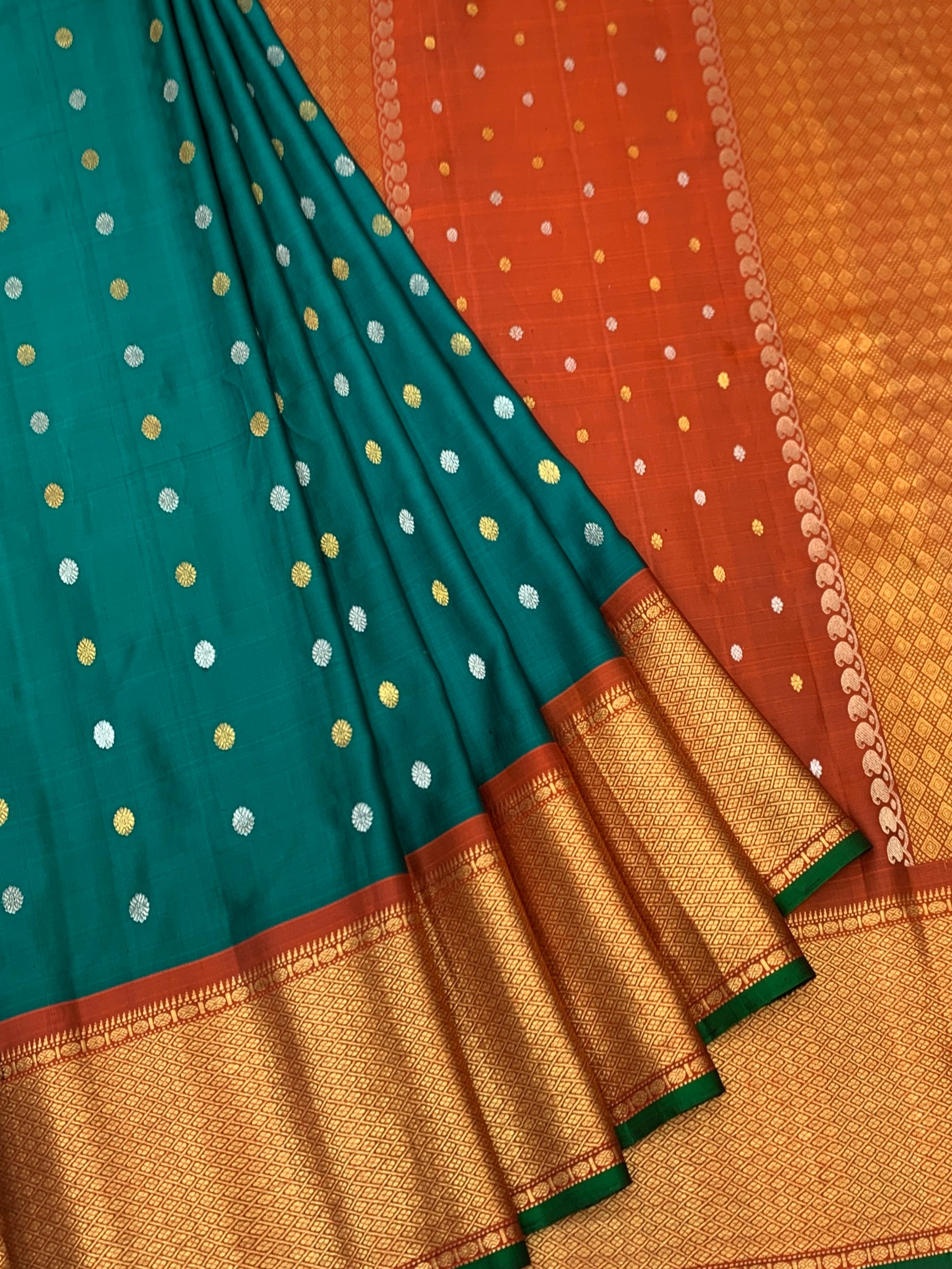 Exquisite Emerald Green & Rust Orange Gadwal Twill Pattu Saree