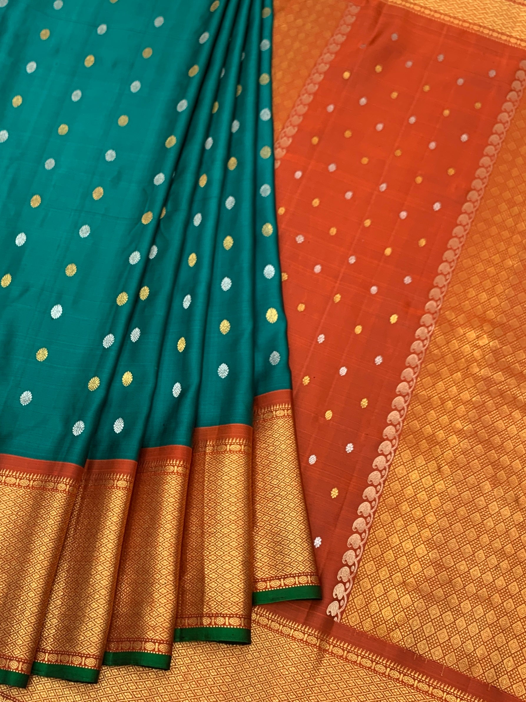 Exquisite Emerald Green & Rust Orange Gadwal Twill Pattu Saree