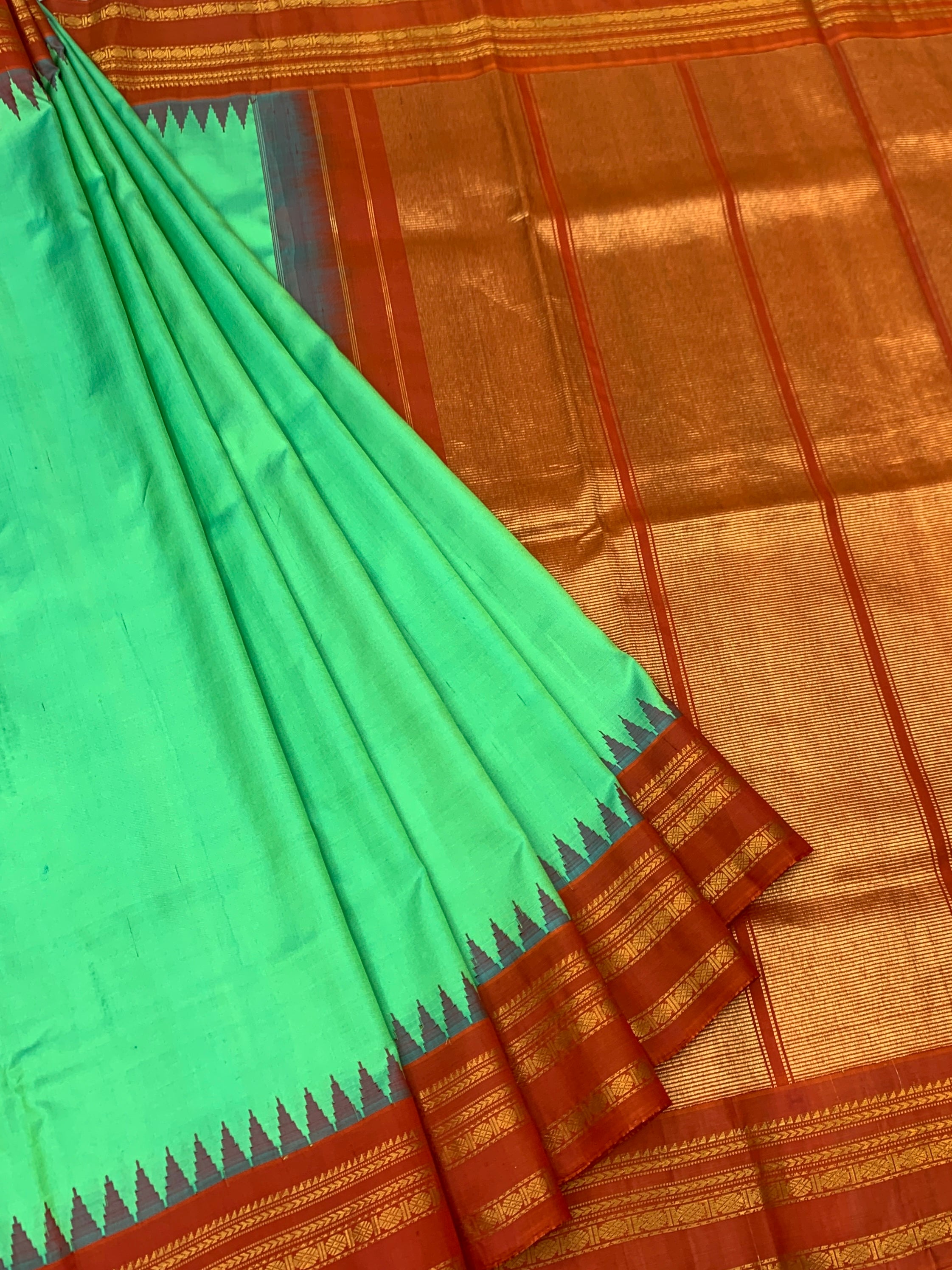 Gadwal Pattu Saree – Emerald Green with Rust Orange & Gold Border