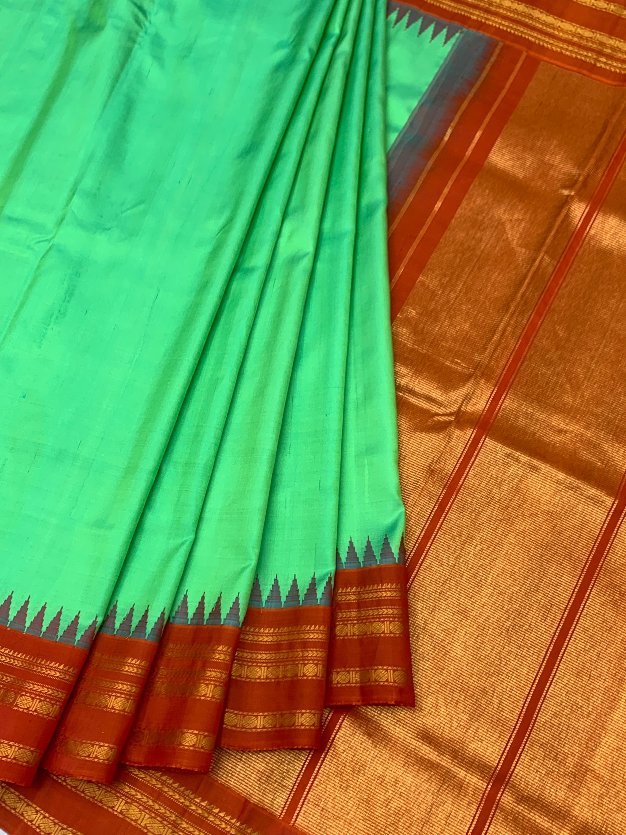 Gadwal Pattu Saree – Emerald Green with Rust Orange & Gold Border